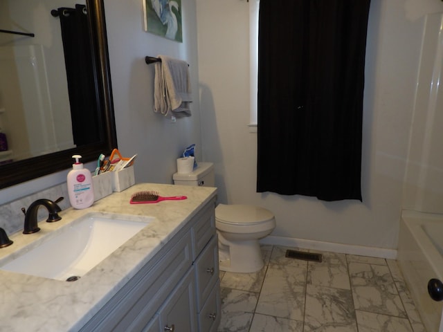 bathroom with vanity and toilet