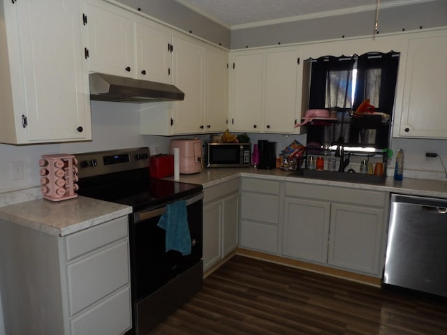 kitchen featuring white cabinetry, stainless steel appliances, sink, ornamental molding, and dark hardwood / wood-style floors