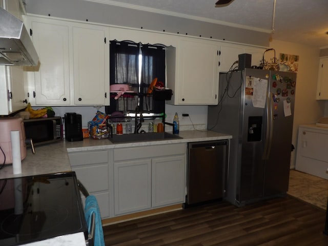 kitchen featuring appliances with stainless steel finishes, white cabinetry, and exhaust hood