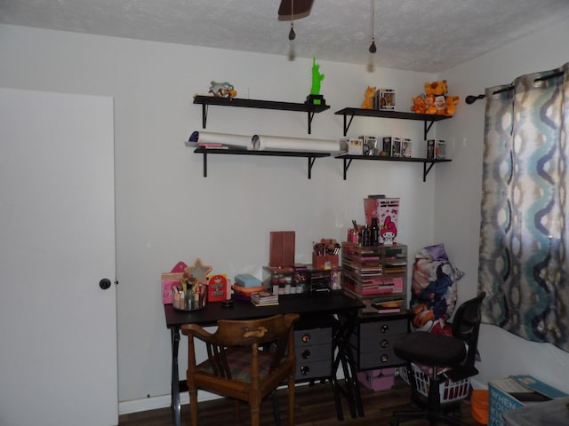 office with dark hardwood / wood-style flooring and a textured ceiling