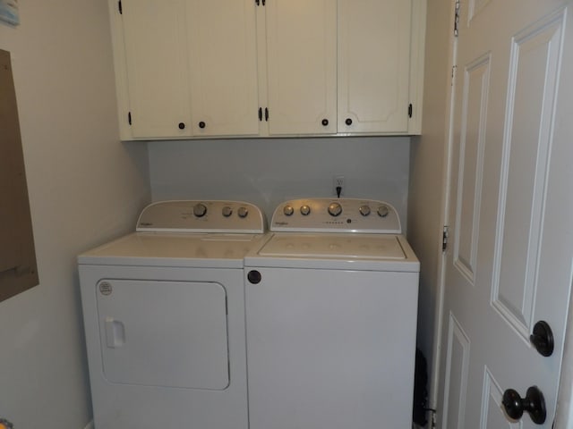 laundry area featuring cabinets and washing machine and clothes dryer