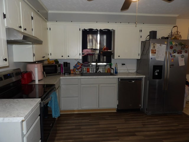 kitchen featuring appliances with stainless steel finishes, sink, dark hardwood / wood-style floors, and white cabinets