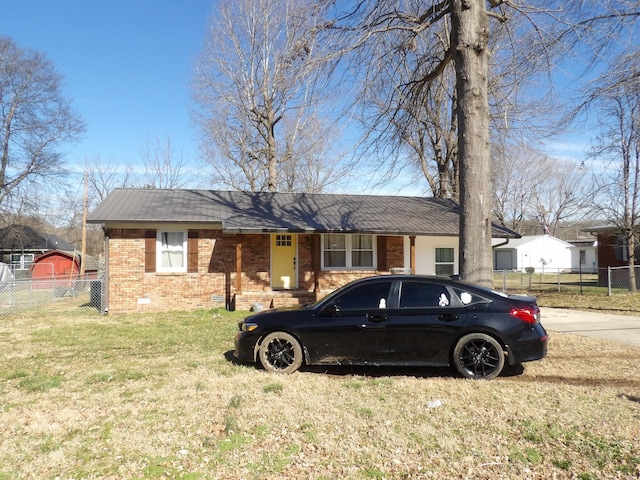 single story home with a front yard