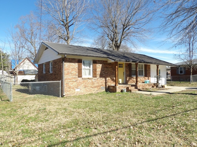 ranch-style home featuring covered porch and a front yard