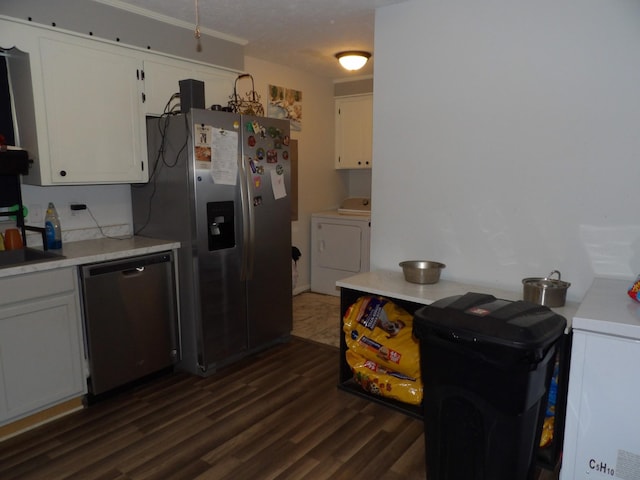 kitchen featuring white cabinets, appliances with stainless steel finishes, washer and dryer, and dark hardwood / wood-style floors