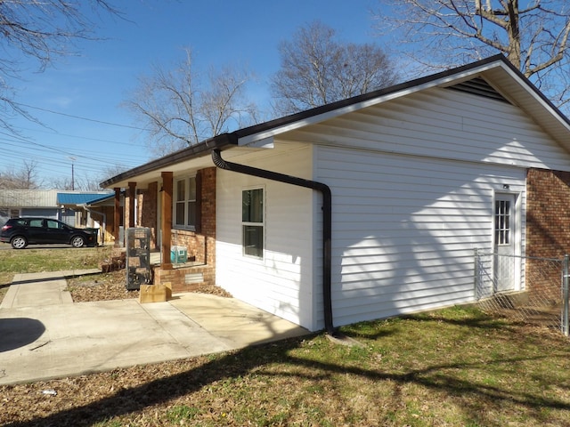 view of side of home featuring a patio