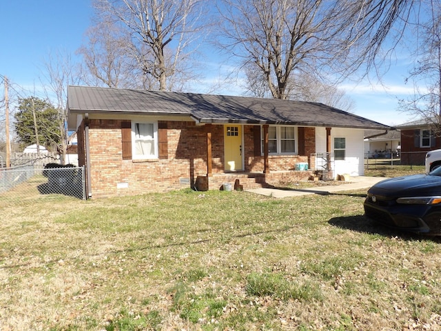 ranch-style house with covered porch and a front lawn