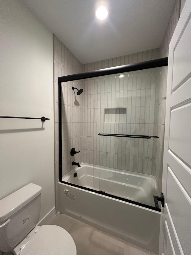 4928 Elmview Ct, Smyrna, TN 37167 - bathroom featuring baseboards, toilet, and enclosed tub / shower combo