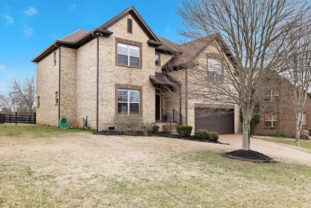 view of front property with a front lawn and a garage