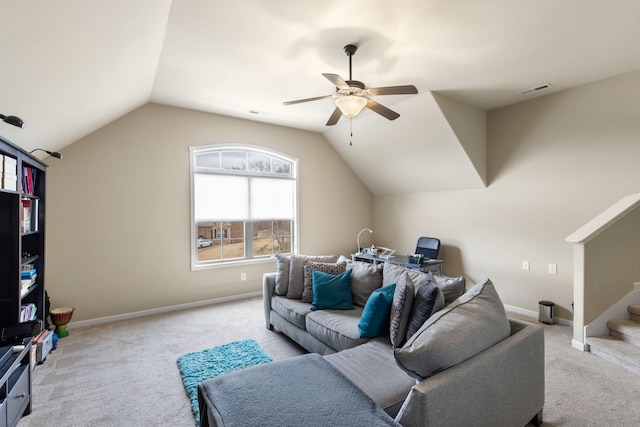 living room featuring ceiling fan, vaulted ceiling, and light carpet