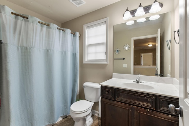 bathroom with toilet, vanity, tile patterned flooring, and curtained shower