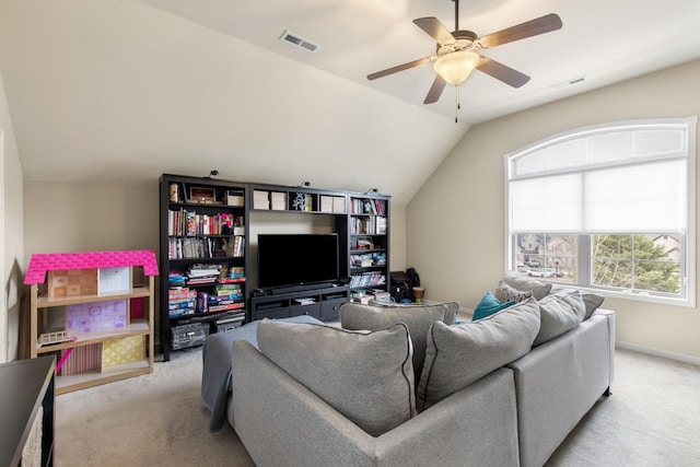 carpeted living room with lofted ceiling and ceiling fan