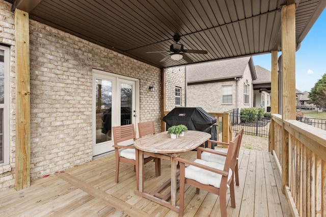 deck with ceiling fan and a grill