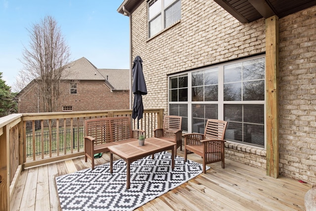 wooden terrace with outdoor lounge area