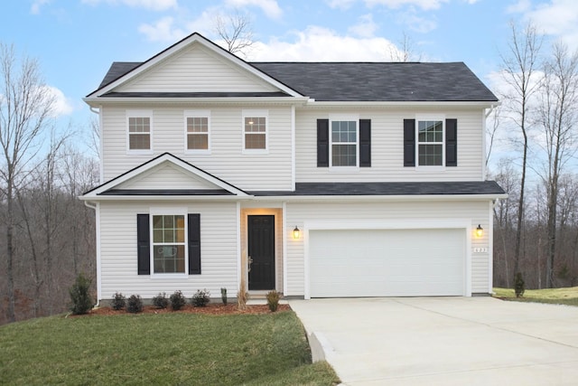 front of property with a front yard and a garage