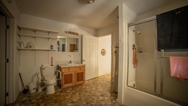 full bathroom with toilet, vanity, and bath / shower combo with glass door