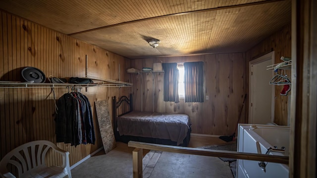 unfurnished bedroom with wooden walls and wooden ceiling