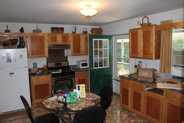 kitchen featuring white appliances and cooling unit