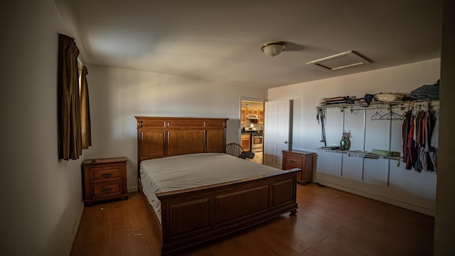 bedroom with dark hardwood / wood-style flooring