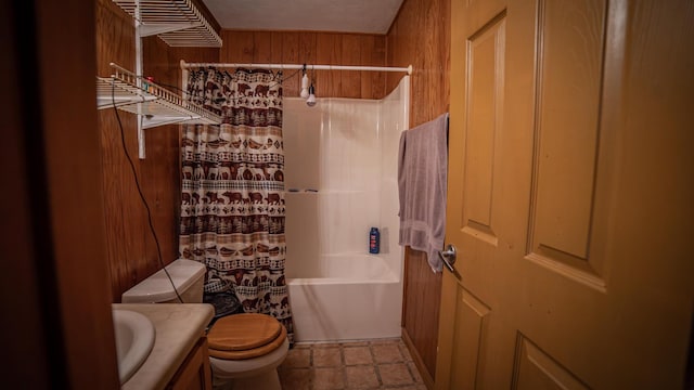 full bathroom with shower / bath combo with shower curtain, vanity, wood walls, and toilet