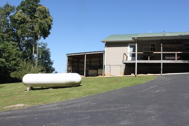 view of outbuilding featuring a yard