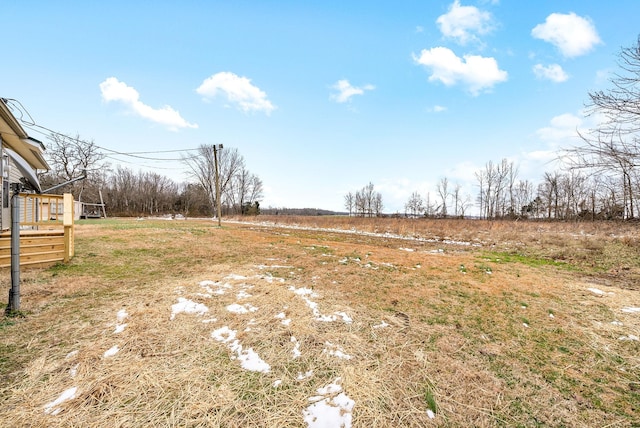 view of yard with a rural view