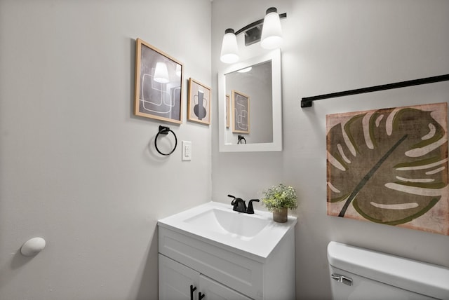 bathroom with toilet and vanity