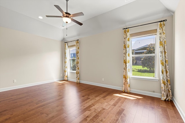 empty room featuring lofted ceiling, ceiling fan, and wood-type flooring