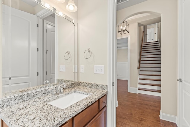 bathroom with vanity and wood-type flooring