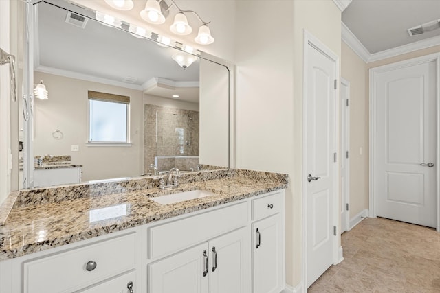 bathroom with ornamental molding, a tile shower, and vanity