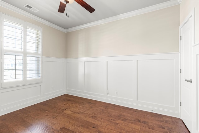 empty room with dark hardwood / wood-style flooring, ceiling fan, crown molding, and a wealth of natural light