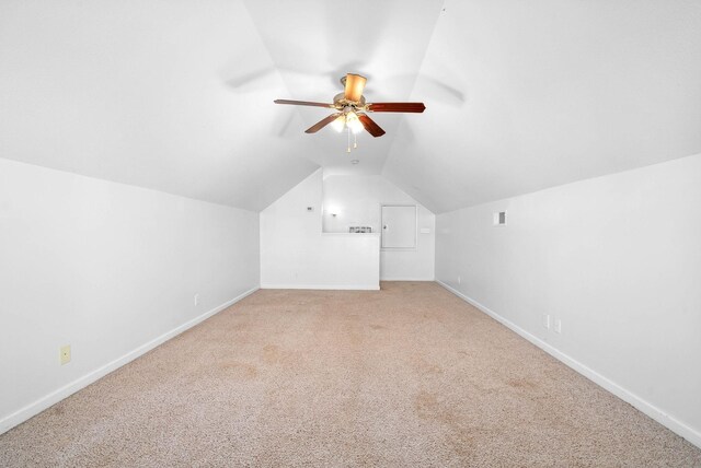 bonus room featuring vaulted ceiling, carpet flooring, and ceiling fan