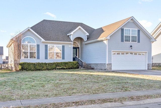 view of front of house featuring a garage and a front yard