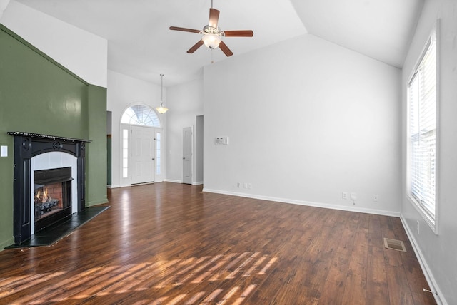 unfurnished living room featuring ceiling fan, high vaulted ceiling, and dark hardwood / wood-style floors