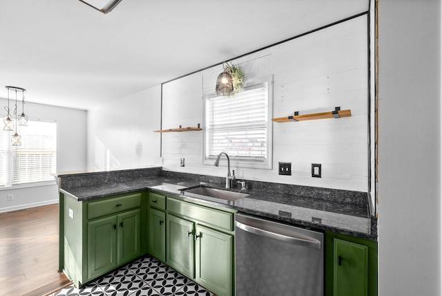 kitchen featuring sink, pendant lighting, dark stone counters, green cabinetry, and stainless steel dishwasher