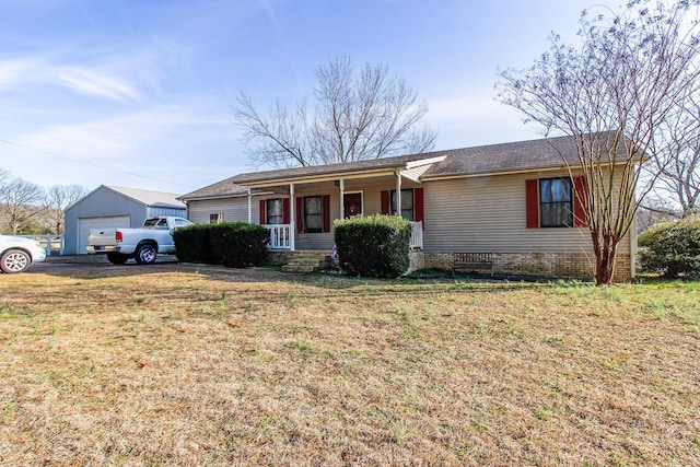 ranch-style house with a front yard, a garage, an outdoor structure, and a porch