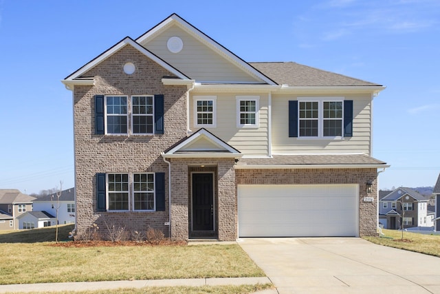 view of front facade with driveway, a front lawn, and brick siding