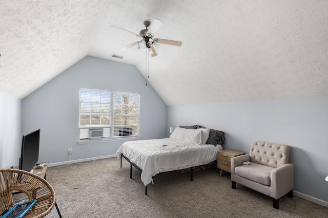 carpeted bedroom featuring cooling unit, vaulted ceiling, ceiling fan, and a textured ceiling