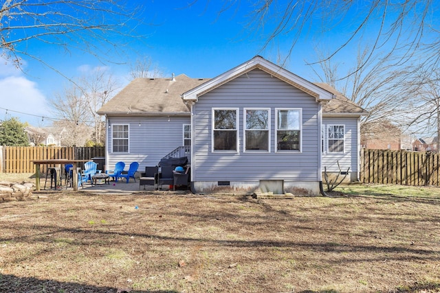 back of property featuring a yard and a patio area