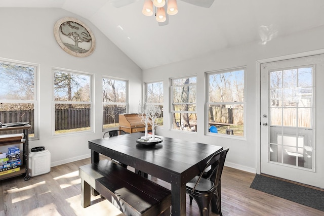 sunroom / solarium featuring vaulted ceiling and a wealth of natural light