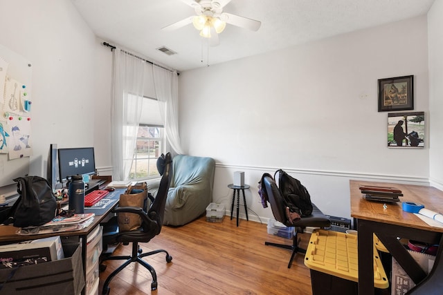 office space with hardwood / wood-style flooring and ceiling fan