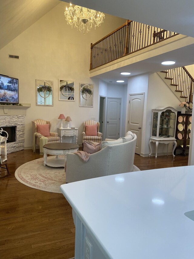 5107 General Eisenhower Dr, Murfreesboro, TN 37129 - living area featuring a towering ceiling, a fireplace, dark wood finished floors, and visible vents