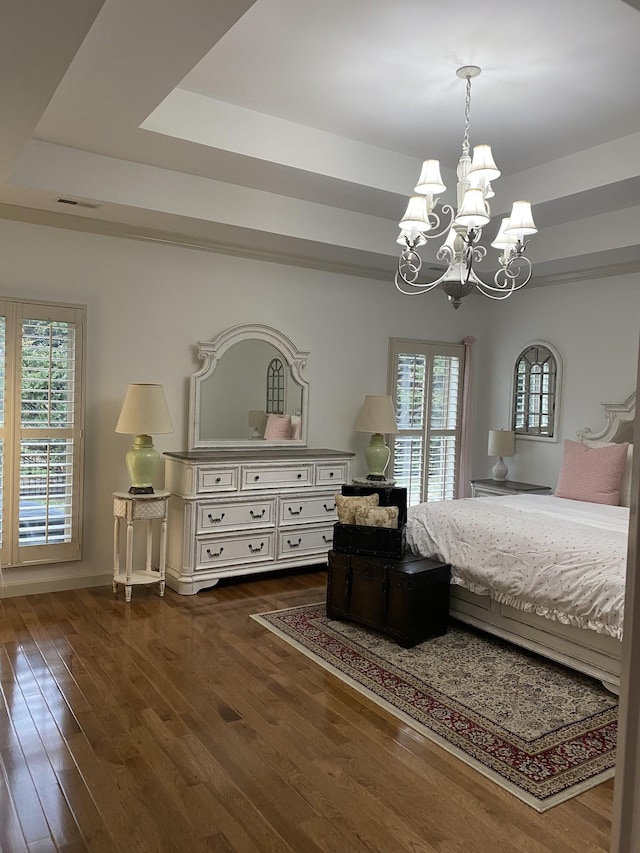 5107 General Eisenhower Dr, Murfreesboro, TN 37129 - bedroom with dark wood-style floors, a tray ceiling, and multiple windows