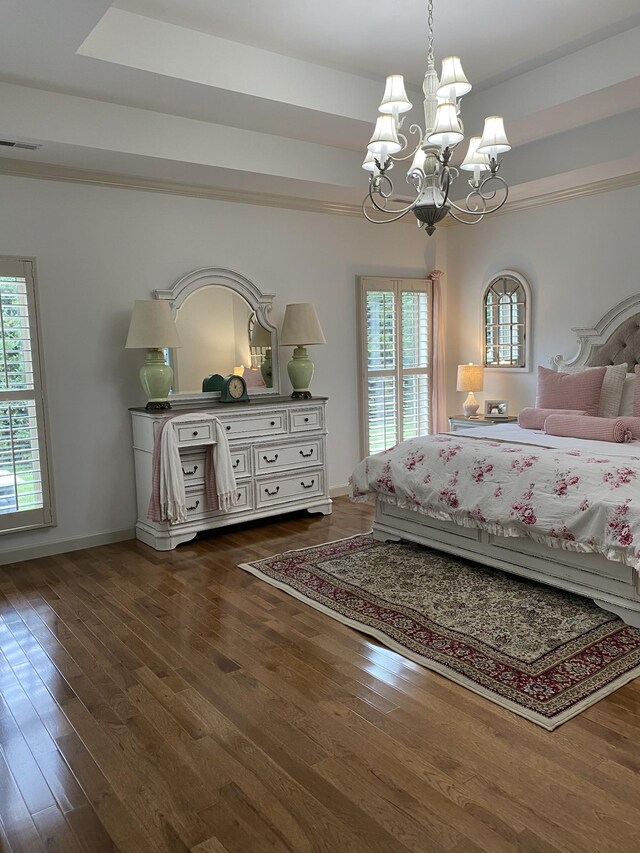 5107 General Eisenhower Dr, Murfreesboro, TN 37129 - unfurnished bedroom featuring baseboards, visible vents, a raised ceiling, dark wood finished floors, and an inviting chandelier