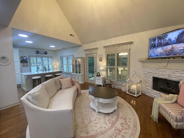 5107 General Eisenhower Dr, Murfreesboro, TN 37129 - living room with dark wood finished floors, a fireplace, visible vents, high vaulted ceiling, and baseboards