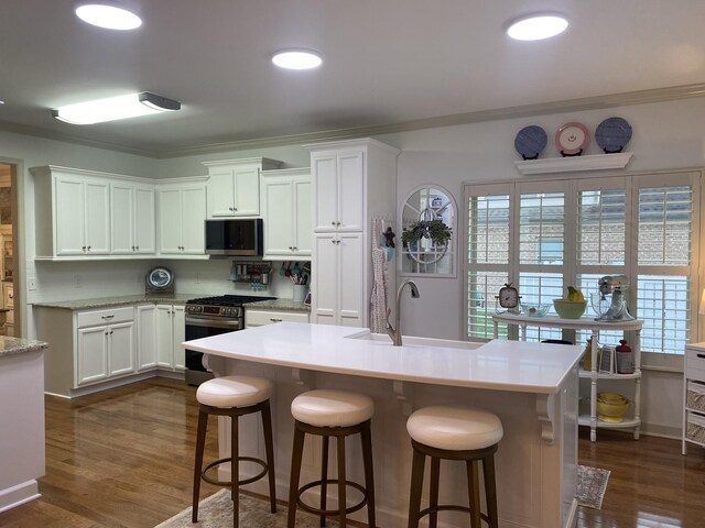 5107 General Eisenhower Dr, Murfreesboro, TN 37129 - kitchen with white cabinetry, appliances with stainless steel finishes, light countertops, and a sink