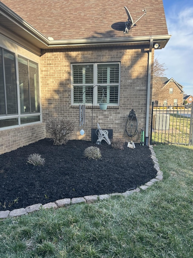 5107 General Eisenhower Dr, Murfreesboro, TN 37129 - view of property exterior featuring brick siding, roof with shingles, fence, and a lawn