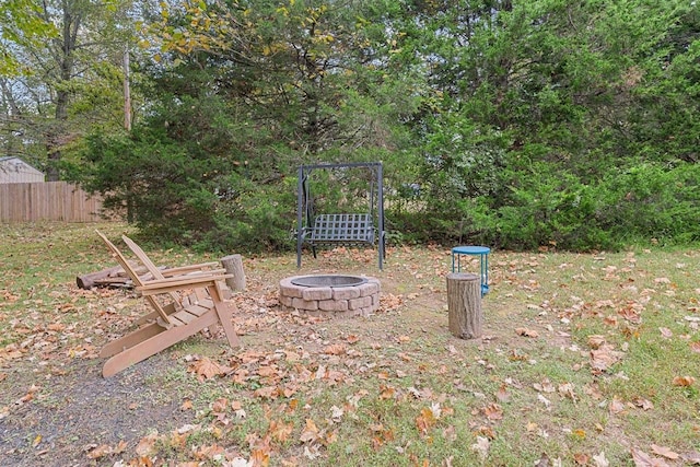 view of yard featuring an outdoor fire pit