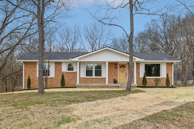 ranch-style home featuring a front yard