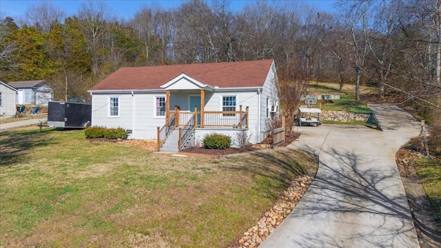 bungalow-style home featuring a front yard and a porch